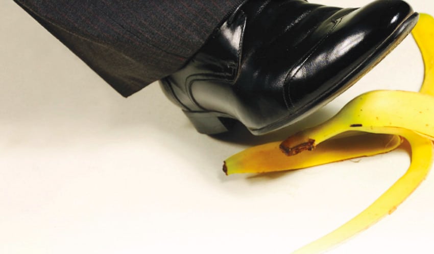 A shoe stepping on a banana peel.